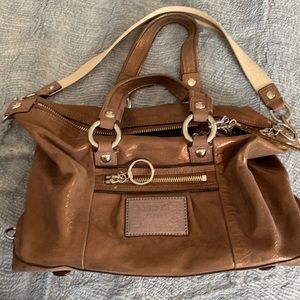 Coach purse. Bronze-y, coppery color, goldish sparkles.